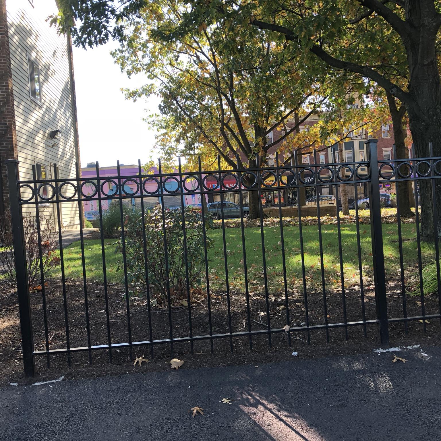 Black ornamental aluminum fence installation by Lynch Fence in Rhode Island