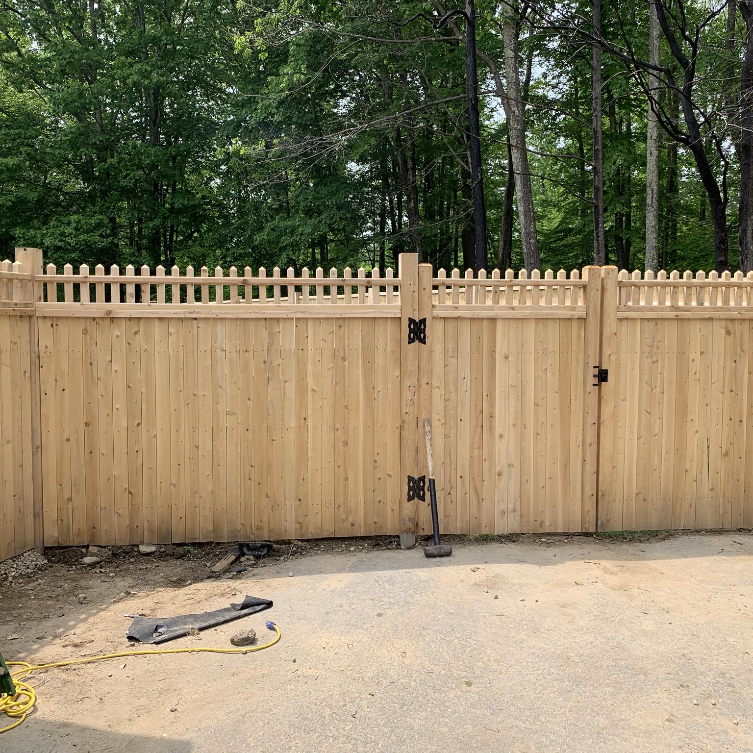 Custom cedar wood privacy fence with double gate installed by Lynch Fence Co Inc Rhode Island