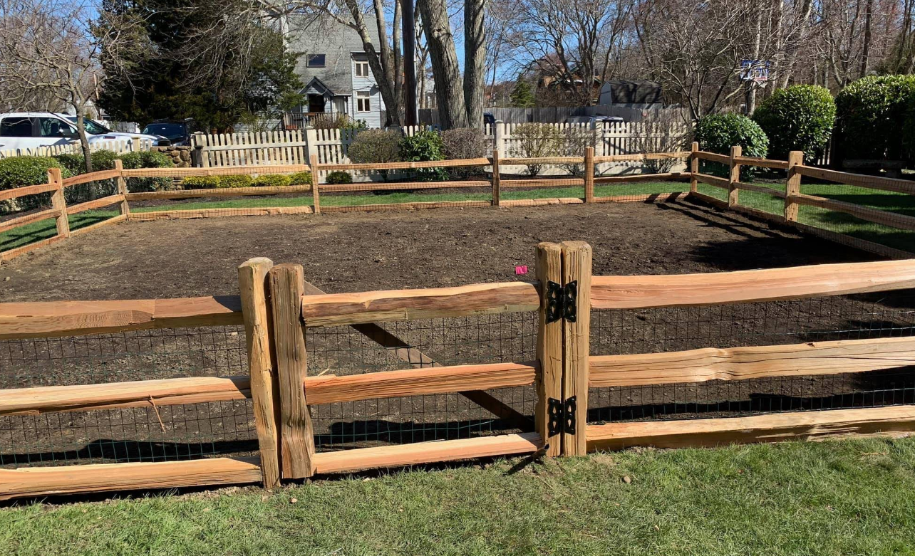 Western split rail wood fence with gate installed in Rhode Island