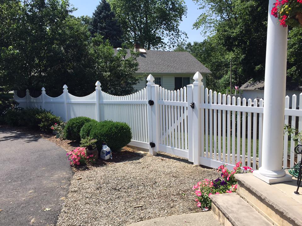 White vinyl scalloped driveway entrance gate installed in Rhode Island