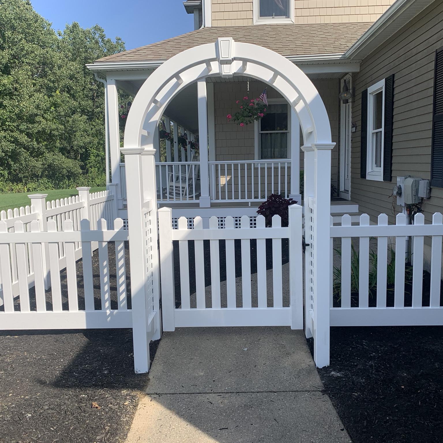 White vinyl arch gate fence installation by Lynch Fence Co Inc in North Smithfield Rhode Island